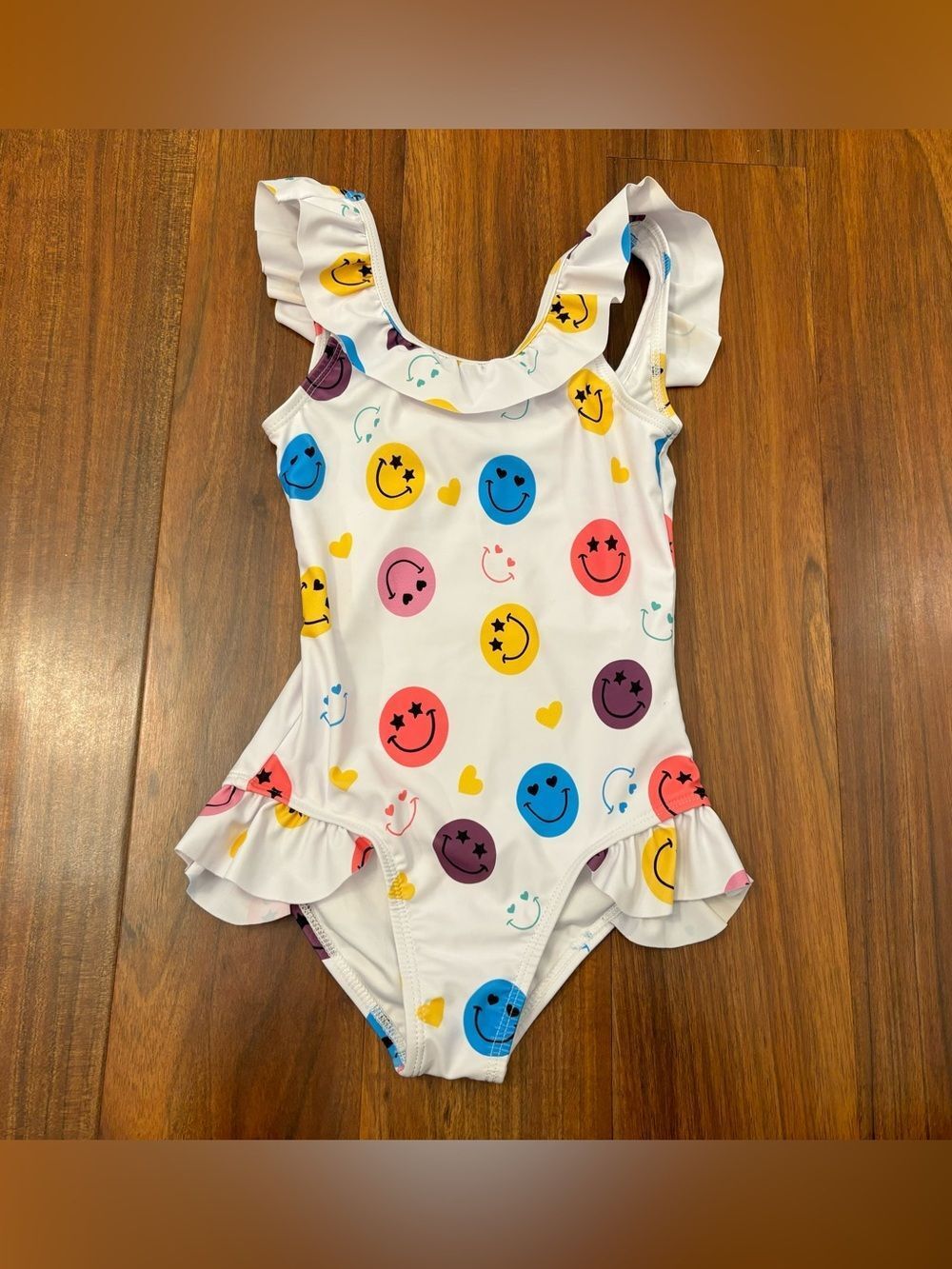 Lola + The Boys white smiley face one piece ruffle bathing suit